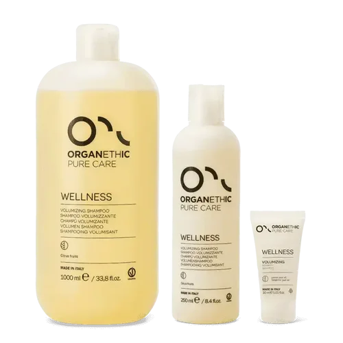 Three bottles of wellness shampoo