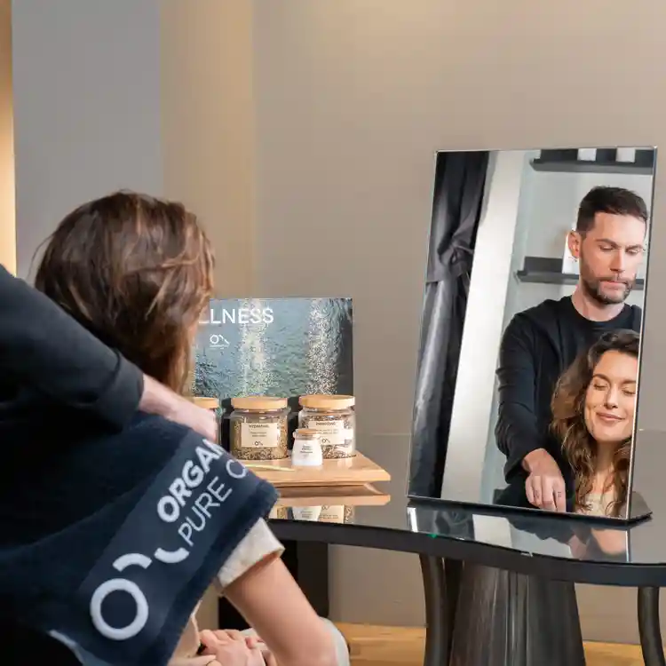 Hairdresser and client performing OPC Ritua; Head SPA treatment