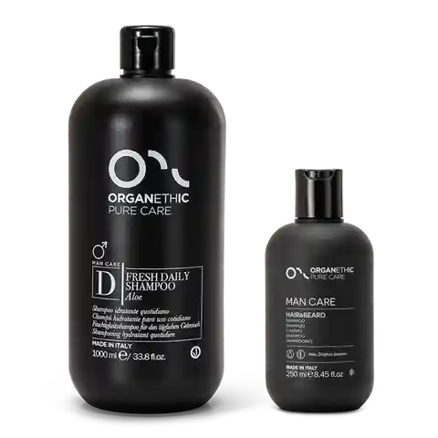 two sizes of OPC man care shampoo in black bottles