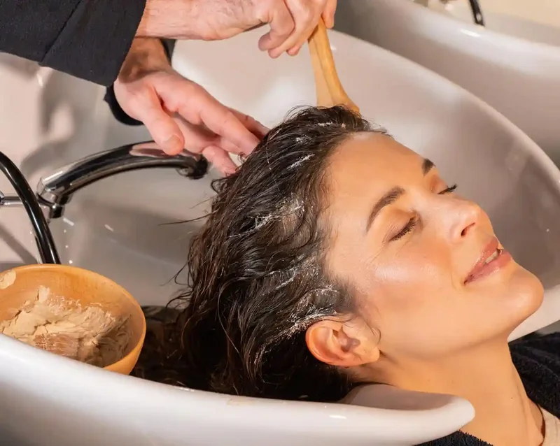 woman receiving a head SPA treatment