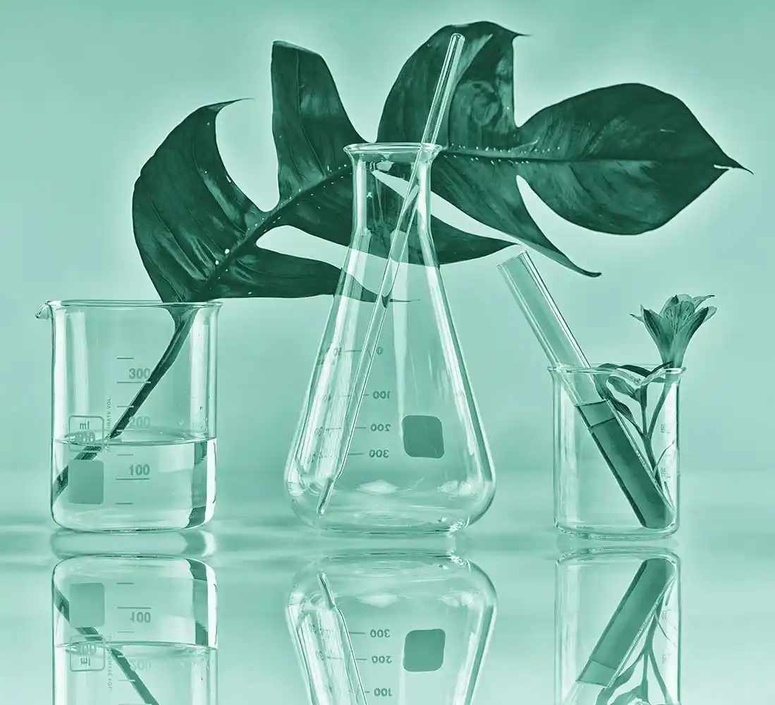 laboratory testing, plants and glass bottles.