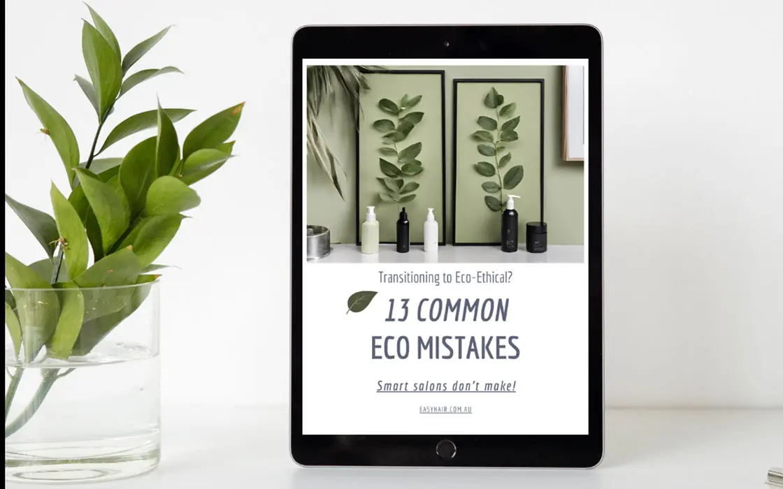 ipad on a shelf with the screen of '13 common eco mistakes hair salons make"